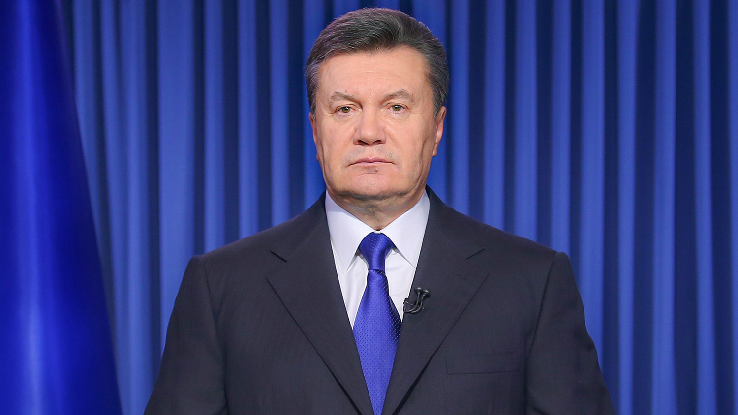 Ukrainian President Viktor Yanukovych addresses the nation on a live TV broadcast in Kiev, Ukraine, early Wednesday, Feb. 19, 2014. In a statement published online early Wednesday, Yanukovych blamed opposition leaders for the violence, saying that they had “crossed a line when they called people to arms.” (AP Photo/Andrei Mosienko, Pool)